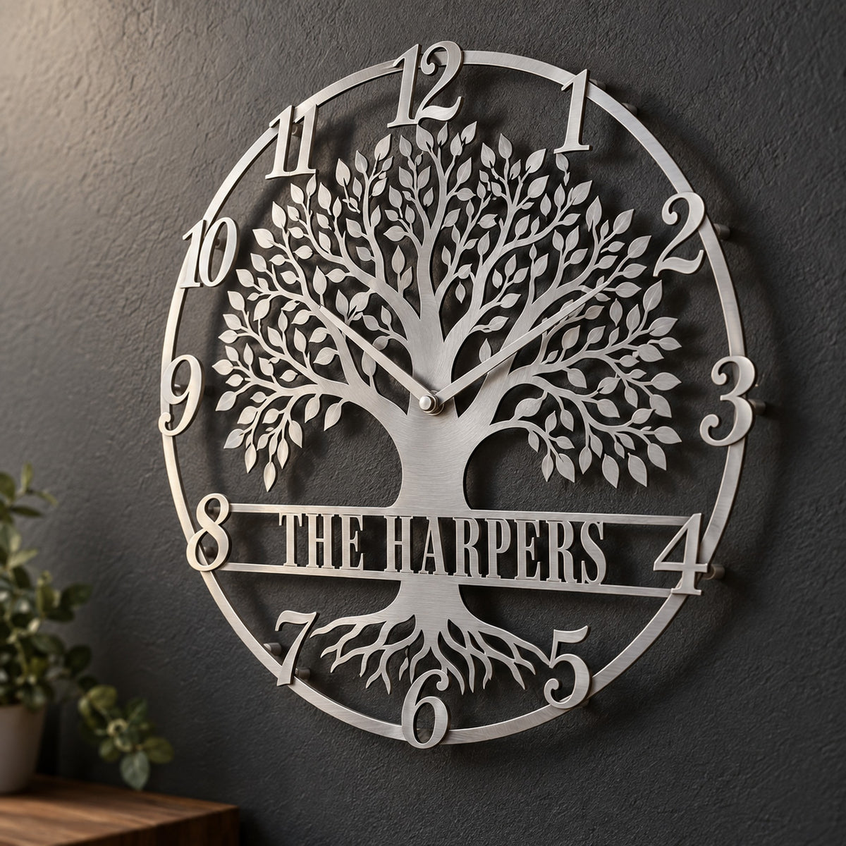 Silver personalized Tree of Life metal wall clock with script numerals and a The Harpers banner on a charcoal wall