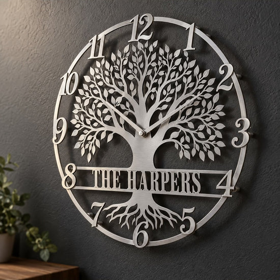 Silver personalized Tree of Life metal wall clock with script numerals and a The Harpers banner on a charcoal wall – short video